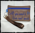 ALL YOU NEED IS LOVE AND MUSIC WRISTLET PURSE