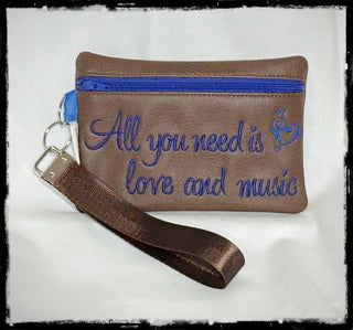 ALL YOU NEED IS LOVE AND MUSIC WRISTLET PURSE